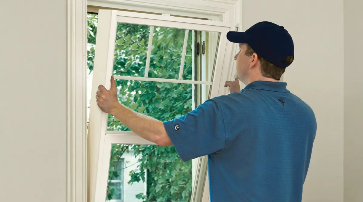 Professional contractors performing a residential window insulation and replacement service in Hollywood, FL